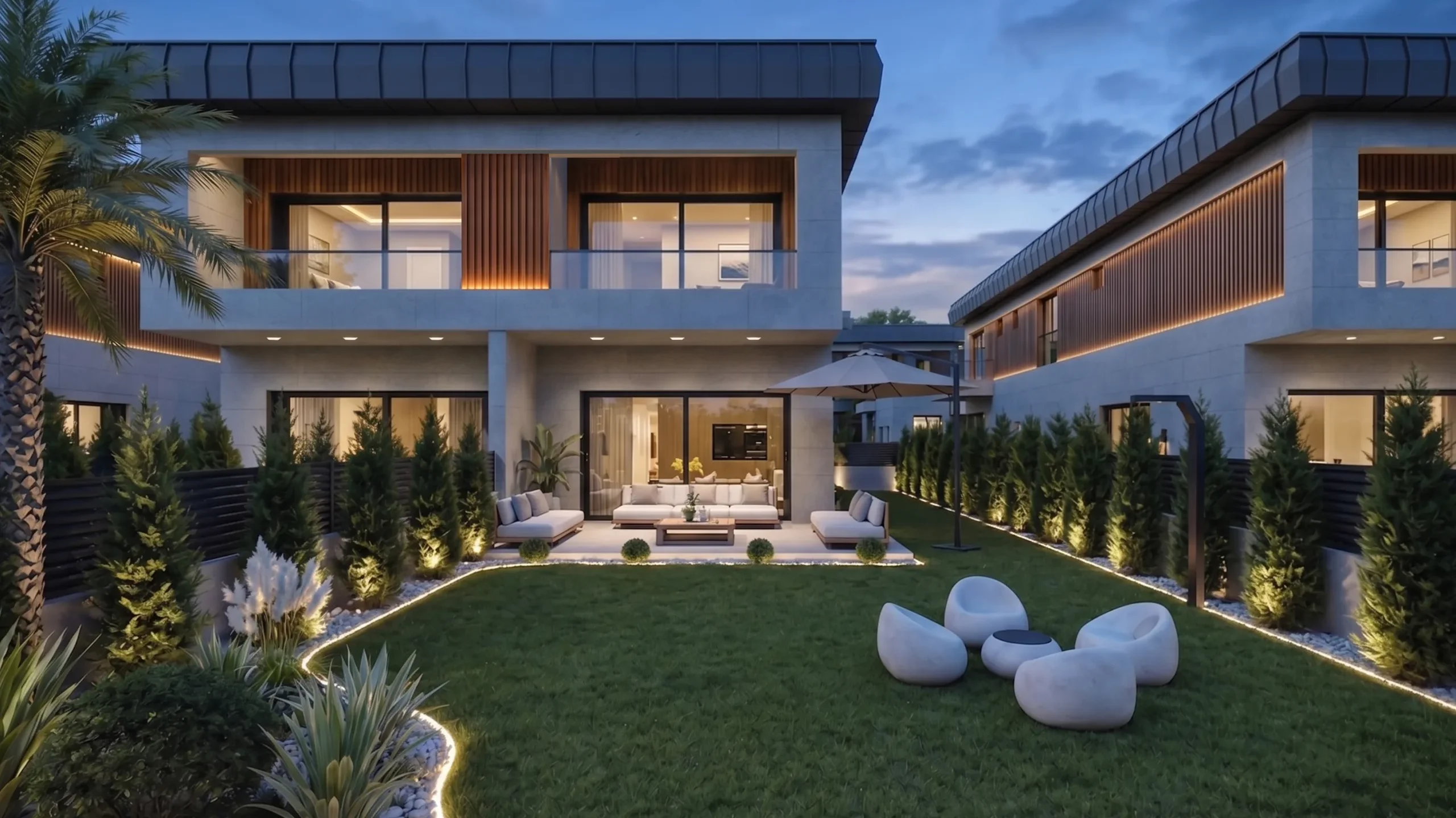 Zen Garden ikiz villalarının akşam görünümü; aydınlatmalı peyzaj ve ortak yeşil alan — Tire, İzmir