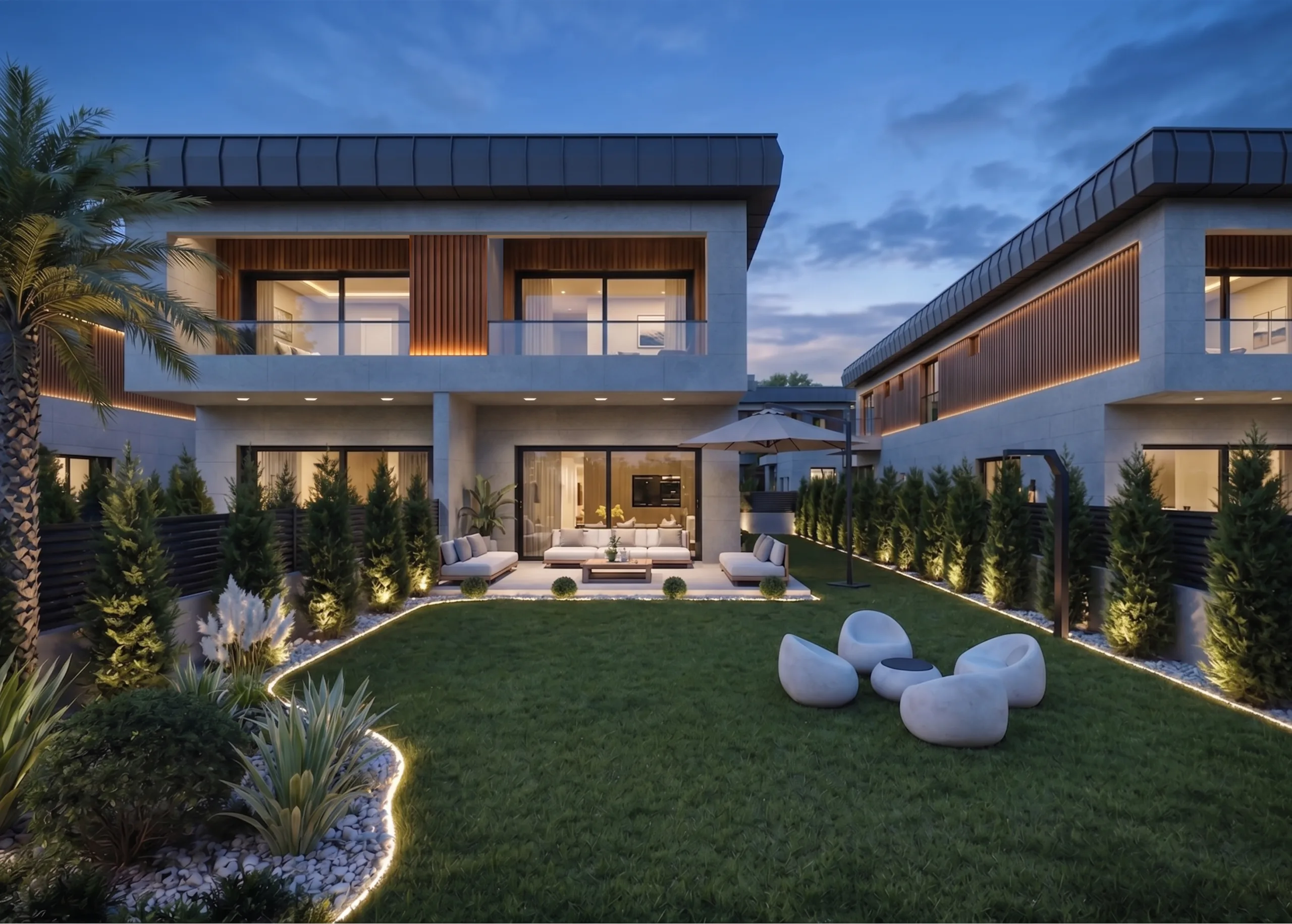 Zen Garden ikiz villalarının akşam görünümü; aydınlatmalı peyzaj ve ortak yeşil alan — Tire, İzmir